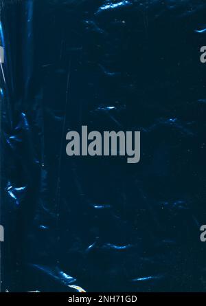 Creased film. Distressed overlay. Used plastic wrap. Blue flare dust scratches noise on dark uneven texture abstract illustration background. Stock Photo