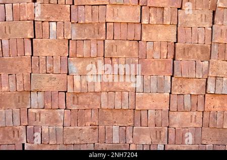 Pile of red bricks texture background Stock Photo