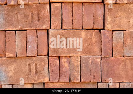 Pile of red bricks texture background Stock Photo