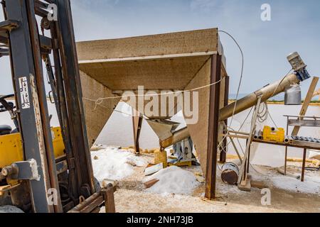 Forklifts at work, salt pans of Trapani Stock Photo