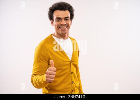 Studio shot portrait of happy smiling multiracial man. Man is looking at camera and smiling. Stock Photo