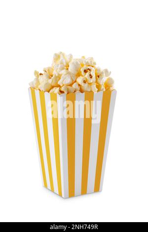 Yellow white striped carton bucket with tasty cheese popcorn, isolated on white background. Fast food, movies, cinema and entertainment concept. Stock Photo