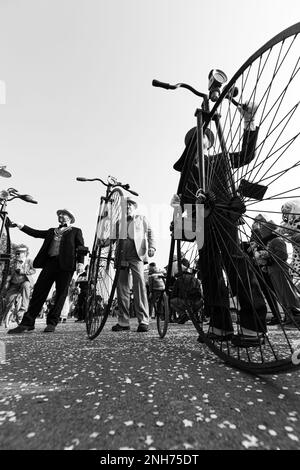 Step Back in Time: High Wheel Bicycle Makes an Appearance at the Carnival Stock Photo