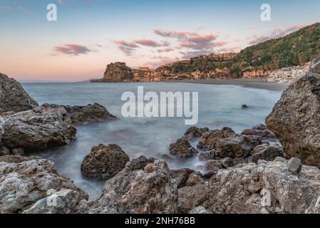 Scilla beach with the town in the background at dusk, Calabria Stock Photo