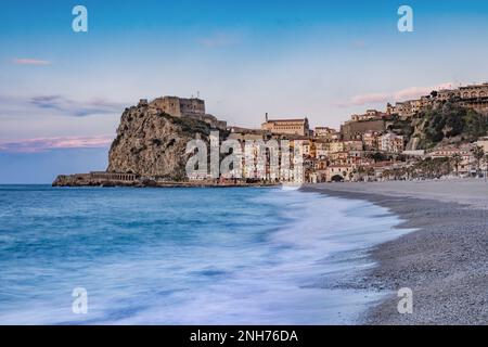 Scilla beach with the town in the background at dusk, Calabria Stock Photo