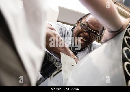 Sydney Ethridge, electronic industrial controls mechanic, Rock Island Arsenal – Joint Manufacturing and Technology Center, Rock Island Arsenal, Ill., safely climbs to all heights to keep the factory’s equipment running ensuring continued production of quality equipment to warfighters. Stock Photo