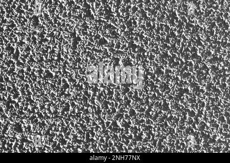 Cement wall with a rough mottled gray surface closeup Stock Photo