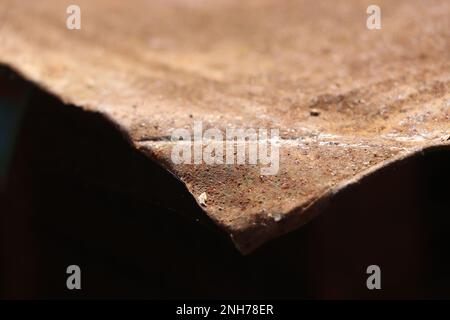 Rusty sheet metal with sunlight falling on its surface on outdoors Stock Photo