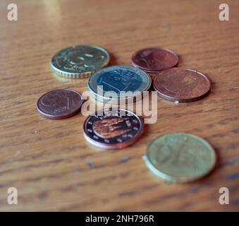 some coins on the table to pay for a cup of coffee in a cafeteria Stock Photo