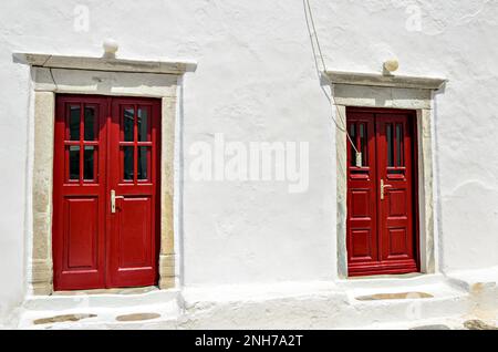 Red door, typical of a house on the island of Myconos, Cyclades, Greece Stock Photo
