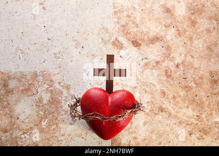 Sacred Heart of Jesus, surrounded by a crown of thorns and with wooden ...