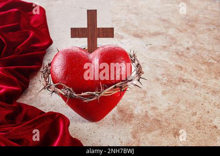Sacred Heart of Jesus, surrounded by a crown of thorns and with wooden ...