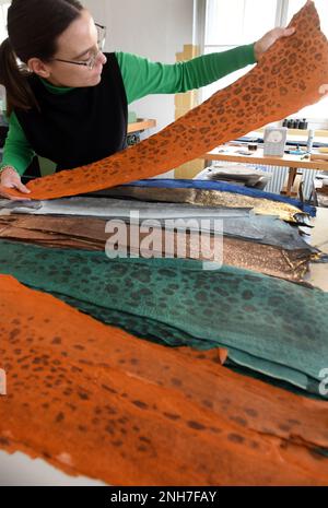 10 February 2023, Saxony, Leipzig: Artist Annekatrin Döll checks ...