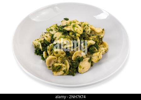Orecchiette pasta with turnip tops, typical Italian recipe from Puglia region in white plate isolated on white with clipping path Stock Photo