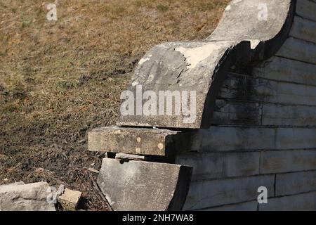 Worn and weathered wall made out of natural limestone masonry blocks. Stock Photo