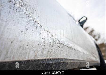 Splash and texture of mud on a car. Dirty car side. Stock Photo