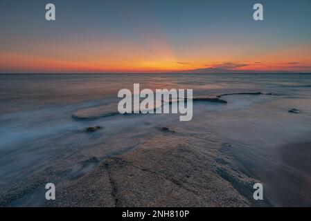 Hawaii beach in the Alikò promontory at dusk, Naxos Stock Photo