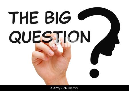 Hand writing The Big Question next to a big question mark. Concept about purpose and meaning of life, philosophy, and existential questions. Stock Photo