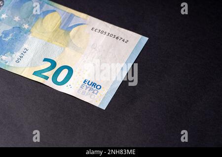 20 euro close up on black background for business finance subjects. World money concept, inflation and economy concept. Currency close up in detail. Stock Photo