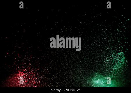 Colorful background of chalk powder. Multicolored dust particles splattered on black background. Stock Photo