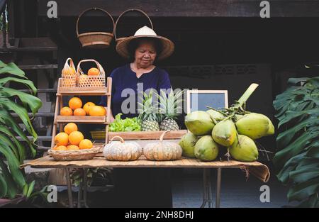 Asia vendor selling fruits at the farm stay, Homestay at Thailand Loei Stock Photo