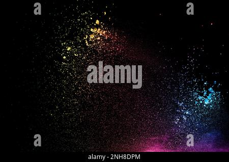 Colorful background of chalk powder. Multicolored dust particles splattered on black background. Stock Photo