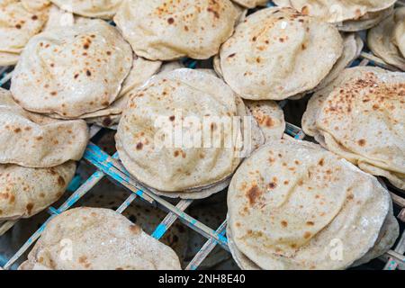 Freshly baked Arabic bread. Bakery in Egypt. Stock Photo