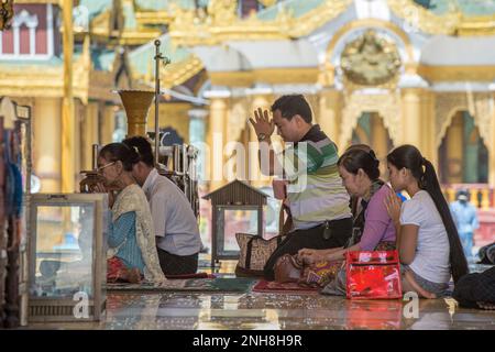 Scene from the Shwedagon Pagoda in Yangon. The temple was begun in the 5th century BC and the famous golden stupa was completed 1500 years ago. Stock Photo