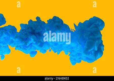 Blue paint clouds in water isolated on solid yellow background. Acrylic colors and ink in water. Abstract background. Isolated. Bright colorful art. Stock Photo