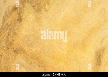 Abstract fluid art background golden colors. Watercolor painting on canvas with soft yellow gradient. Brush stroke texture for design. Oil painted hig Stock Photo