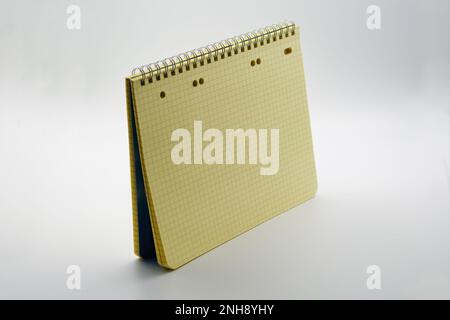 Notebook on a spring. Close-up. Isolated on white background. Stock Photo