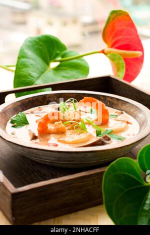 coconut cream soup with prawn,scallops and mushrooms Stock Photo
