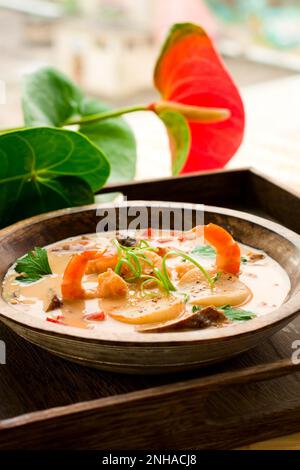 coconut cream soup with prawn,scallops and mushrooms Stock Photo