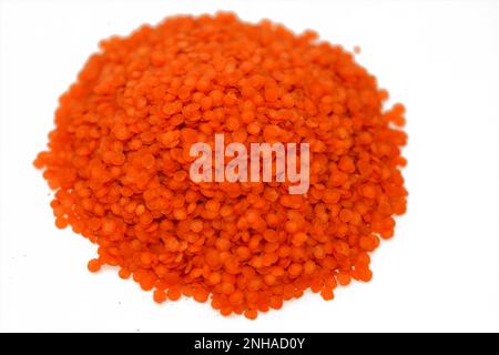 Red lentils, The lentil (Lens culinaris or Lens esculenta), an edible legume. It is an annual plant known for its lens-shaped seeds, the largest produ Stock Photo