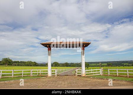 Goiania, Goias, Brazil – February 21, 2023: Entrance to a farm on the side of the road near the city of Goiania. GO-462. Stock Photo