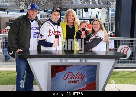 ATLANTA, GA - JANUARY 21: Braves pitcher Jesse Chavez autographs a baseball  for a young fan during the 2023 Braves Fest on January 21, 2023 at The  Battery and Truist Park in