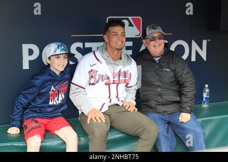 ATLANTA, GA - JANUARY 21: Braves pitcher Jesse Chavez autographs a baseball  for a young fan during the 2023 Braves Fest on January 21, 2023 at The  Battery and Truist Park in