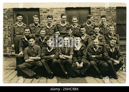 Original WW2 era group photograph of young men, possibly RAF training corps,  Air Cadet Defence Corps / youth training  in blue uniforms. with white lapels. Lots of characters, looking happy. Circa 1940's U.K. Stock Photo