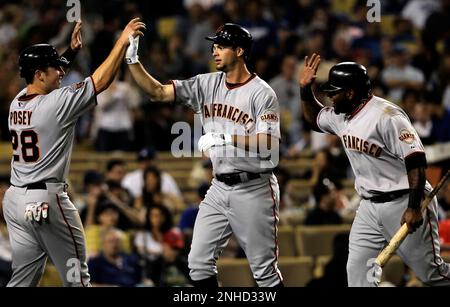 Giants rookie Brandon Belt gets high fives from teammates after his three  run homer to center in the fourth inning against the Los Angeles Dodgers on  Friday at Dodger Stadium. (Michael Macor/San