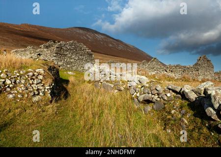 Deserted village and mountain valley under Slievemore mountain on Achill island on the Wild Atlantic Way in County Mayo in Ireland Stock Photo