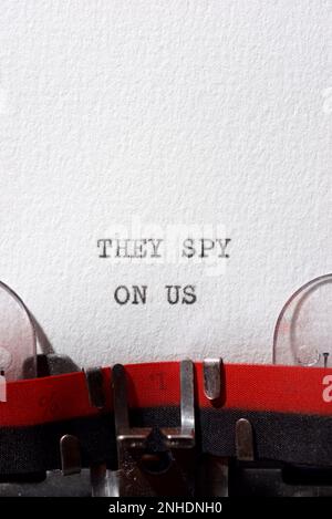 They spy on us text written with a typewriter. Stock Photo