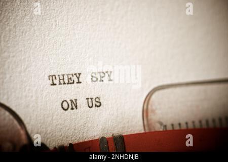 They spy on us text written with a typewriter. Stock Photo