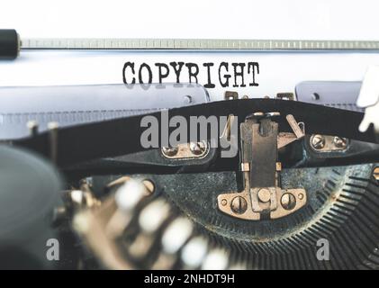 close-up shot of word COPYRIGHT written on old typewriter Stock Photo