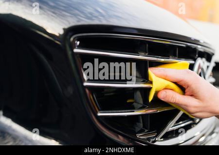 a man cleaning car interior by use foam chemical and scrubbing machine  Stock Photo - Alamy