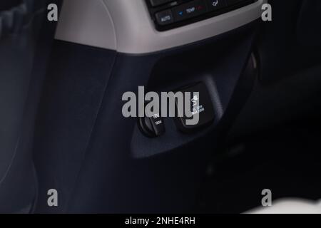 Modern car outlet socket. Closed 12V power outlet socket and 220v power outlet socket in the car. Closed sockets. Stock Photo