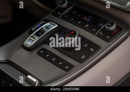 Modern car central console. Drive mode selector button. Stock Photo