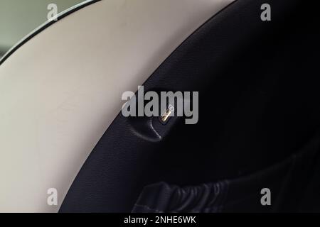 USB port in the car seat close up. Car interior detail. Car usb charger detail. Stock Photo