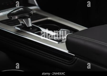 Modern car central console. Drive mode selector button. Stock Photo