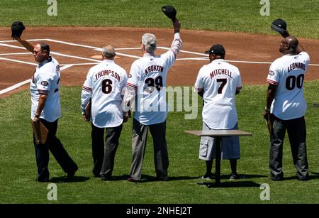 San Francisco Giants Robby Thompson, right, is congratulated by teammates  Brett Butler (2) and Will Clark (22) after Thompson hit a 2 run homer in  the seventh inning against the Chicago Cubs