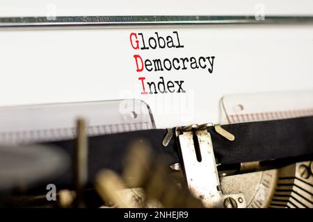 GDI global democracy index symbol. Concept words GDI global democracy index typed on retro typewriter on beautiful white paper background. Business an Stock Photo